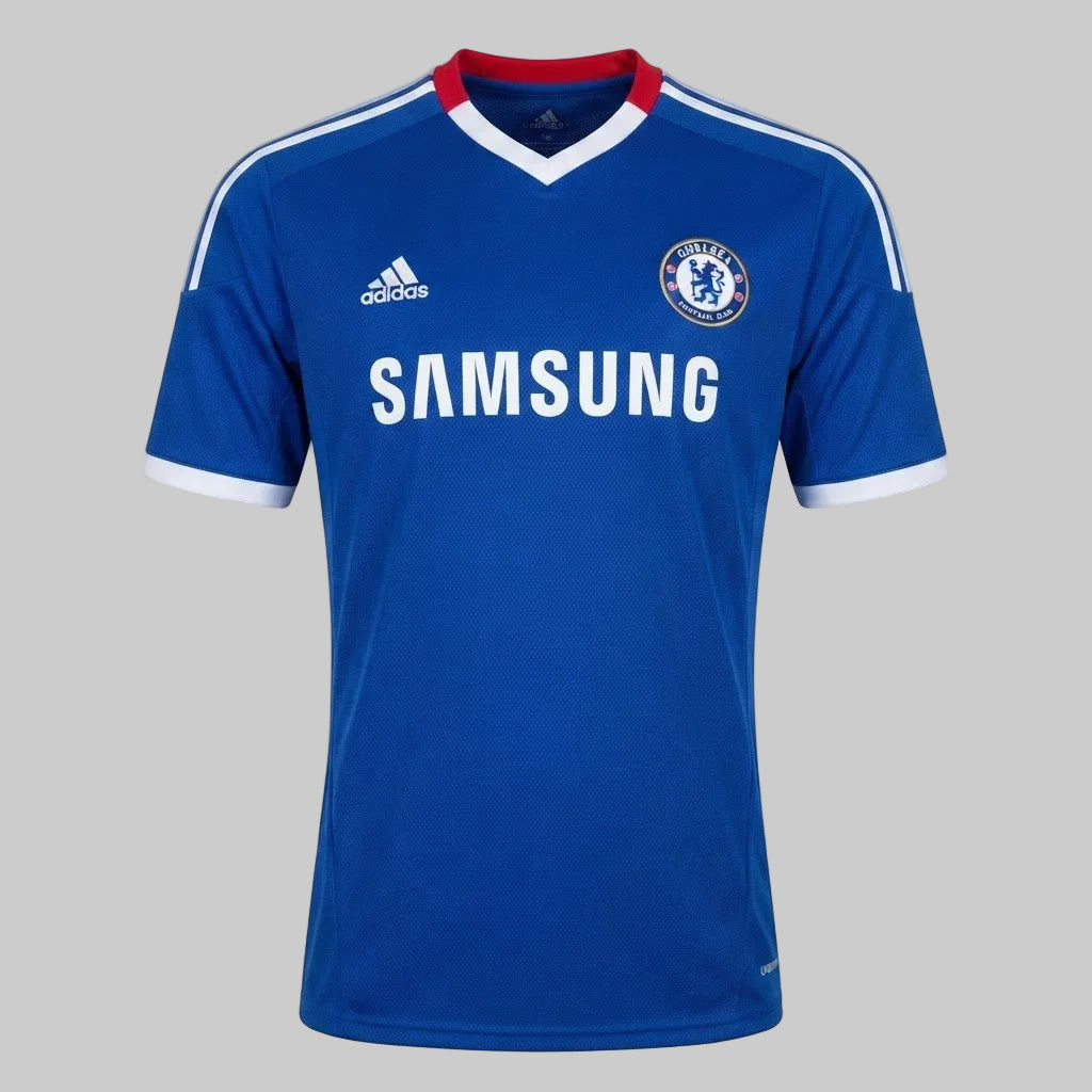Jersey de local del Chelsea FC 2010/11 de Didier Drogba, versión UEFA Champions League, mostrando el escudo del club, logo Adidas y patrocinador Samsung en el pecho, stock Futbol90MX