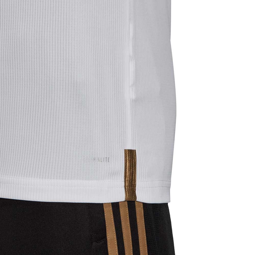 Detalle del dobladillo inferior y la tecnología CLIMALITE del jersey Adidas Ramos Real Madrid UCL 2019/20 (DZ0439), pieza de archivo oficial en Futbol90MX, mostrando la etiqueta de autenticidad.