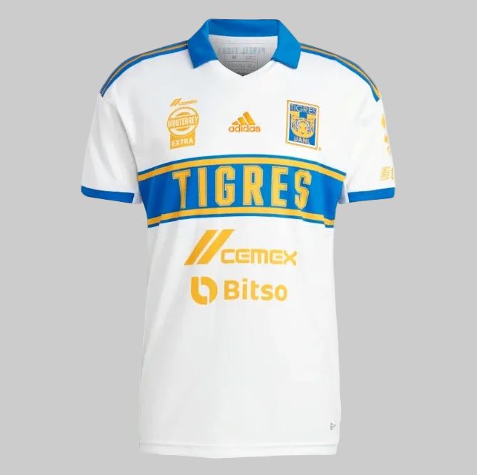 Jersey Adidas Tigres UANL Tercera Equipación 2023 HT4210 vista frontal. Diseño histórico en blanco con franja azul y detalles amarillos, estado Deadstock 10/10 BNWT en Futbol90MX