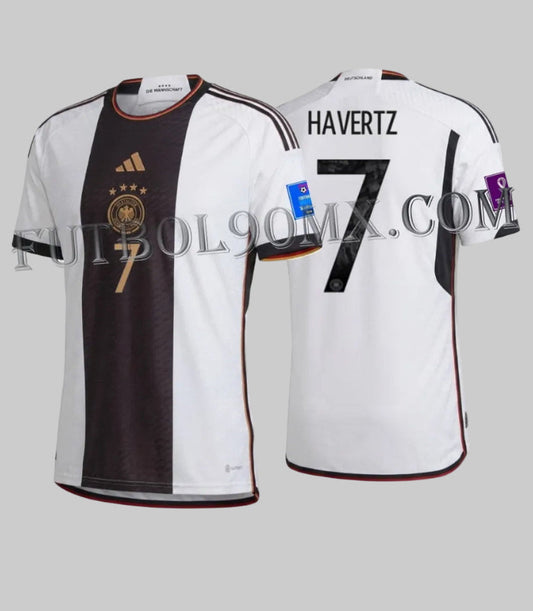 Vista dual del Jersey oficial Adidas Alemania Local de Kai Havertz, versión Authentic Match, codigo HF1693, con dorsal 7 y parches oficiales de la Copa Mundial FIFA Qatar 2022.
