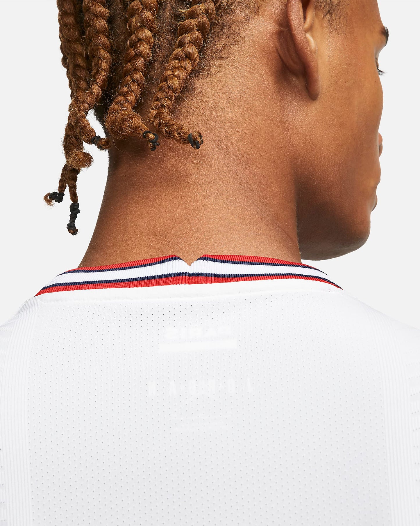 Cuello elástico con franjas Hechter azul y rojo y etiquetas internas de la versión de jugador (Player Issue).