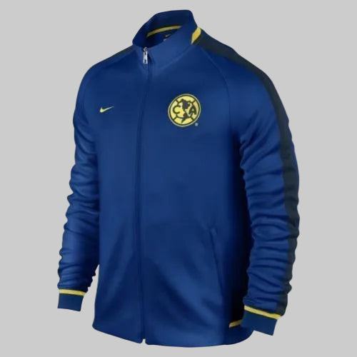Chamarra Nike 689903-431 N98 Club América 2015-16 color azul Gym Blue con escudo bordado y cierre frontal.
