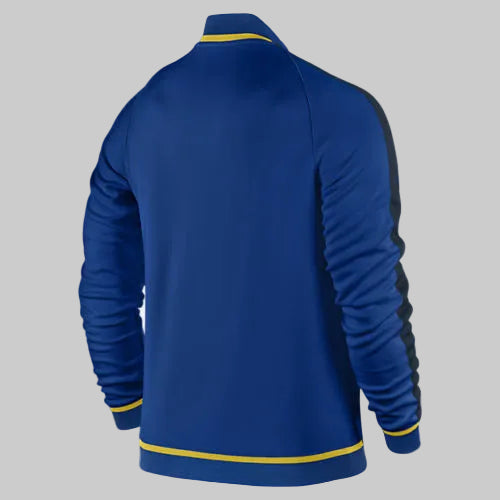 Parte trasera de la chamarra Club América 2015-16 con detalles en amarillo en cuello y puños.