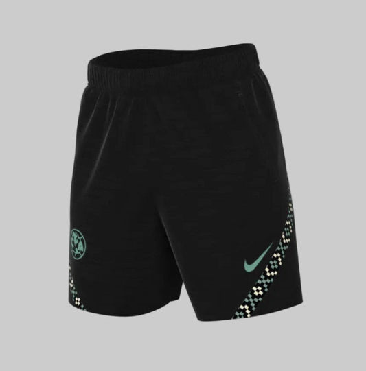 Shorts de entrenamiento Nike DH7718-010 Strike Club América 2021/22 en color negro con logotipos verde jade y patrones geométricos laterales de alta fidelidad.