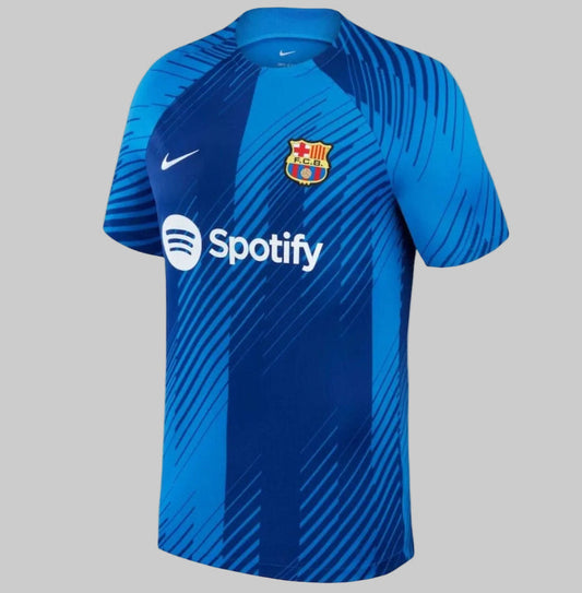 Jersey Nike FC Barcelona Academy Pro Pre-Match 2023/24 DX3610-464 con diseño dinámico asimétrico en tonos azul 