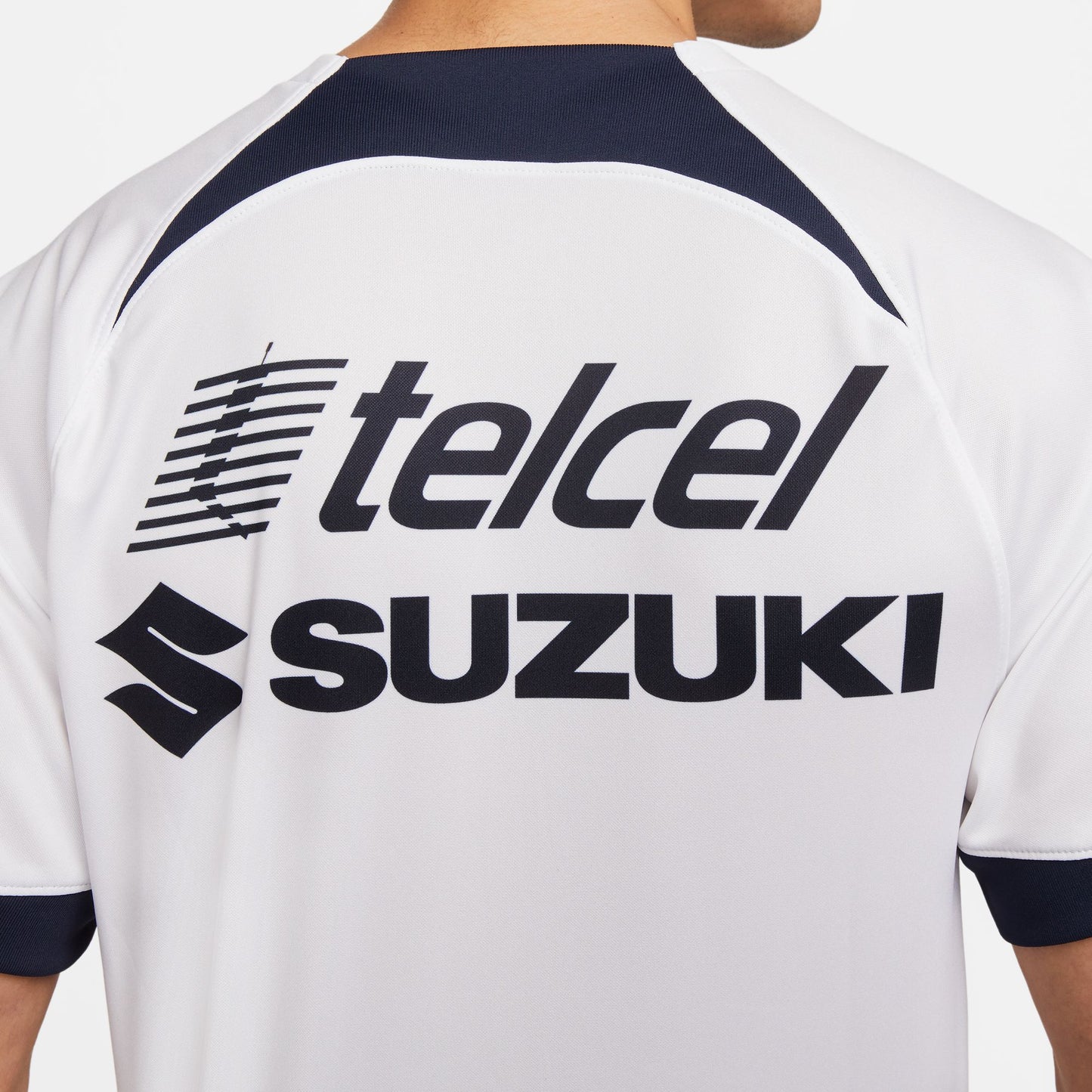 Patrocinadores sublimados en espalda del jersey Nike Pumas UNAM de local 2023/24