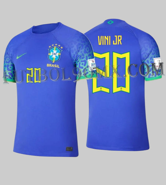Jersey Nike de visitante de la Selección de Brasil 2022 (código DN0678-433) personalizado con el dorsal "VINI JR 20". Se muestra la vista frontal y posterior con los parches oficiales de la Copa Mundial 2022 en las mangas y el distintivo patrón de jaguar, disponible en Futbol90MX