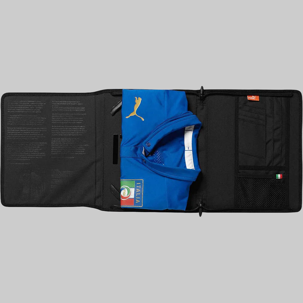 Imagen frontal del jersey Puma Italia Authentic Match ACTV de local 2014 dentro del empaque tecnico
