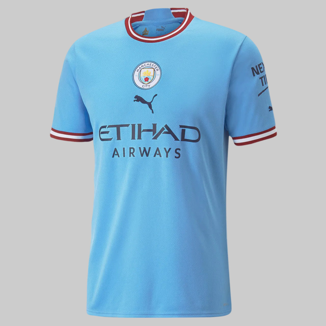 Jersey oficial Puma Manchester City Local 2022/23 de Kevin De Bruyne, edición UEFA Champions League con escudo central y patrocinador Etihad Airways