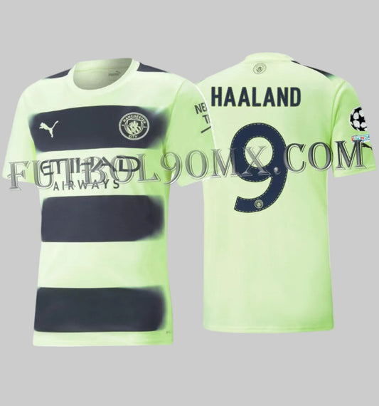 Vista dual del jersey oficial Tercero de Erling Haaland número 9, Manchester City 2022/23, edición UEFA Champions League, codigo Puma 765734 03, disponible en Futbol90MX