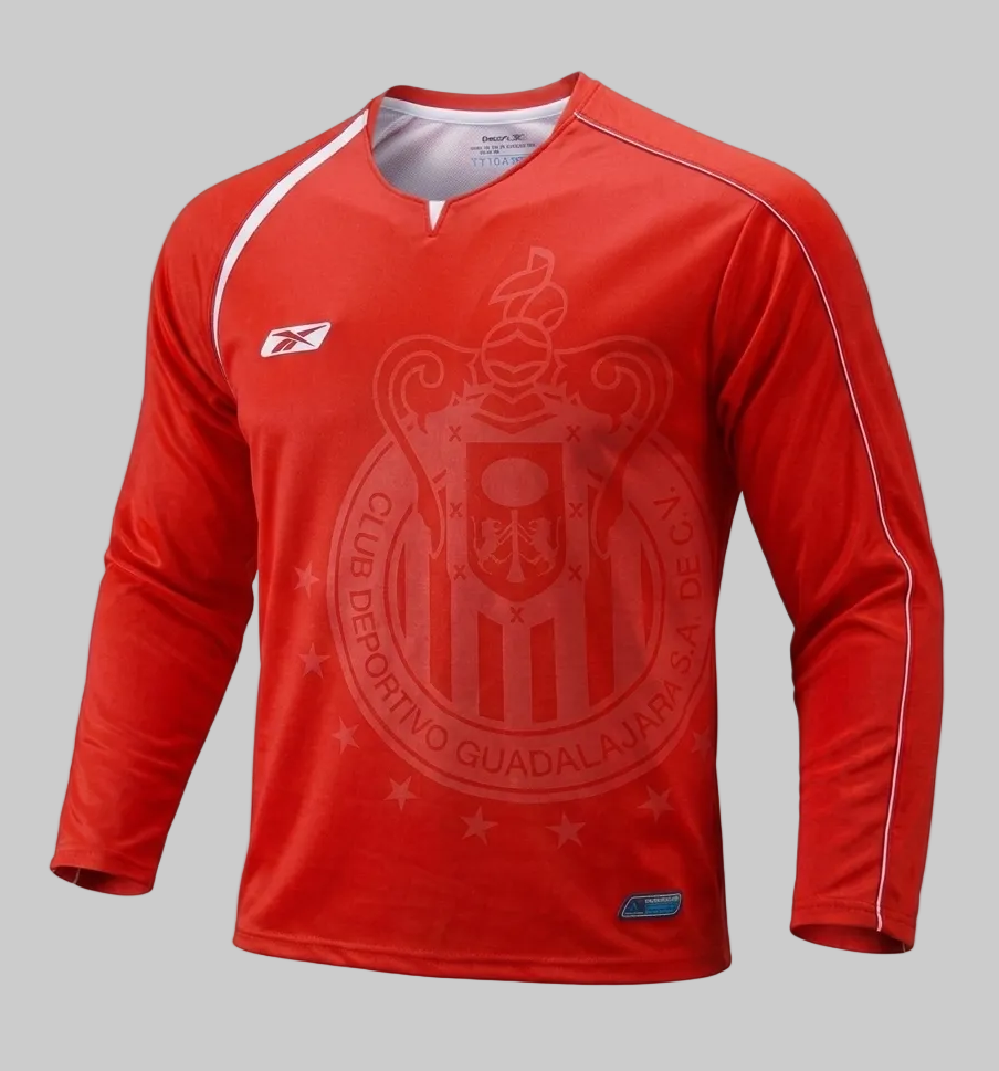 Jersey oficial de portero Chivas 2005-06 manufacturado por Reebok, toma frontal angulada que resalta la textura y el escudo tonal, codigo AMML5013, disponible en Futbol90MX